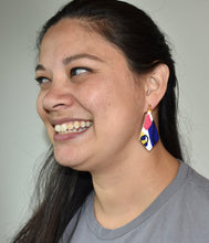 Load image into Gallery viewer, Maggie wearing Cape Town Kite on left ear Cape Town Kite  1.3 L x 0.125 W x 2.5 H Nickel + lead free, gold ball post stud Silicone backings by Pinwheel Clay
