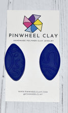 Load image into Gallery viewer, Cape Town Oval Stud - Blue Texture  0.8125 L x 0.125 W x 1.5 H 18K Gold Plated Surgical Steel Earring Posts Silicone backings on earring card by Pinwheel Clay
