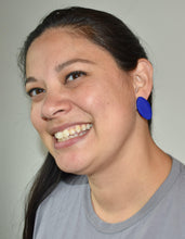 Load image into Gallery viewer, Maggie wearing Cape Town Oval Stud - Blue Texture on left ear Cape Town Oval Stud - Blue Texture  0.8125 L x 0.125 W x 1.5 H 18K Gold Plated Surgical Steel Earring Posts Silicone backings by Pinwheel Clay

