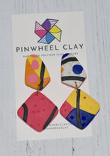 Load image into Gallery viewer, Cape Town Teardrop and Square Dangle  1.125 L x 0.125 W x 2.125 H 18K Gold Plated Surgical Steel Earring Posts Silicone backings on earring card by Pinwheel Clay
